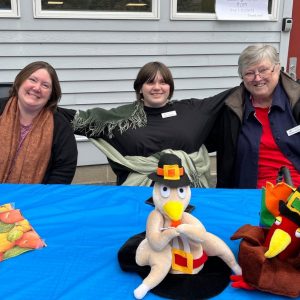 Shirley, Callie, and Sara at the Turkey Supper check-in table