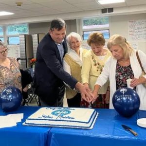 Trinity's Stephen Ministers cut a cake in celebration of new ministry.